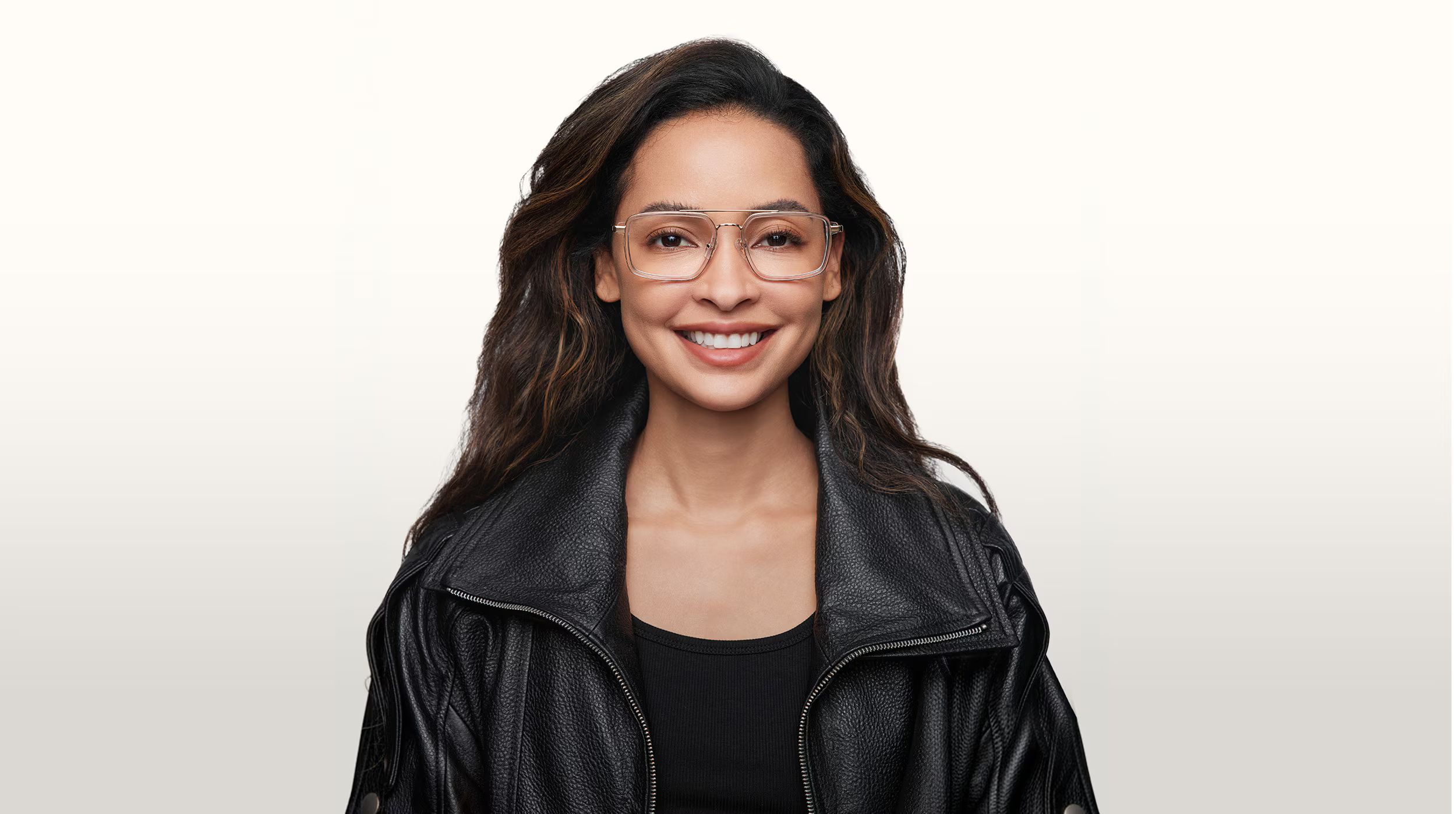 Lady wearing pink tortoise eyeglasses