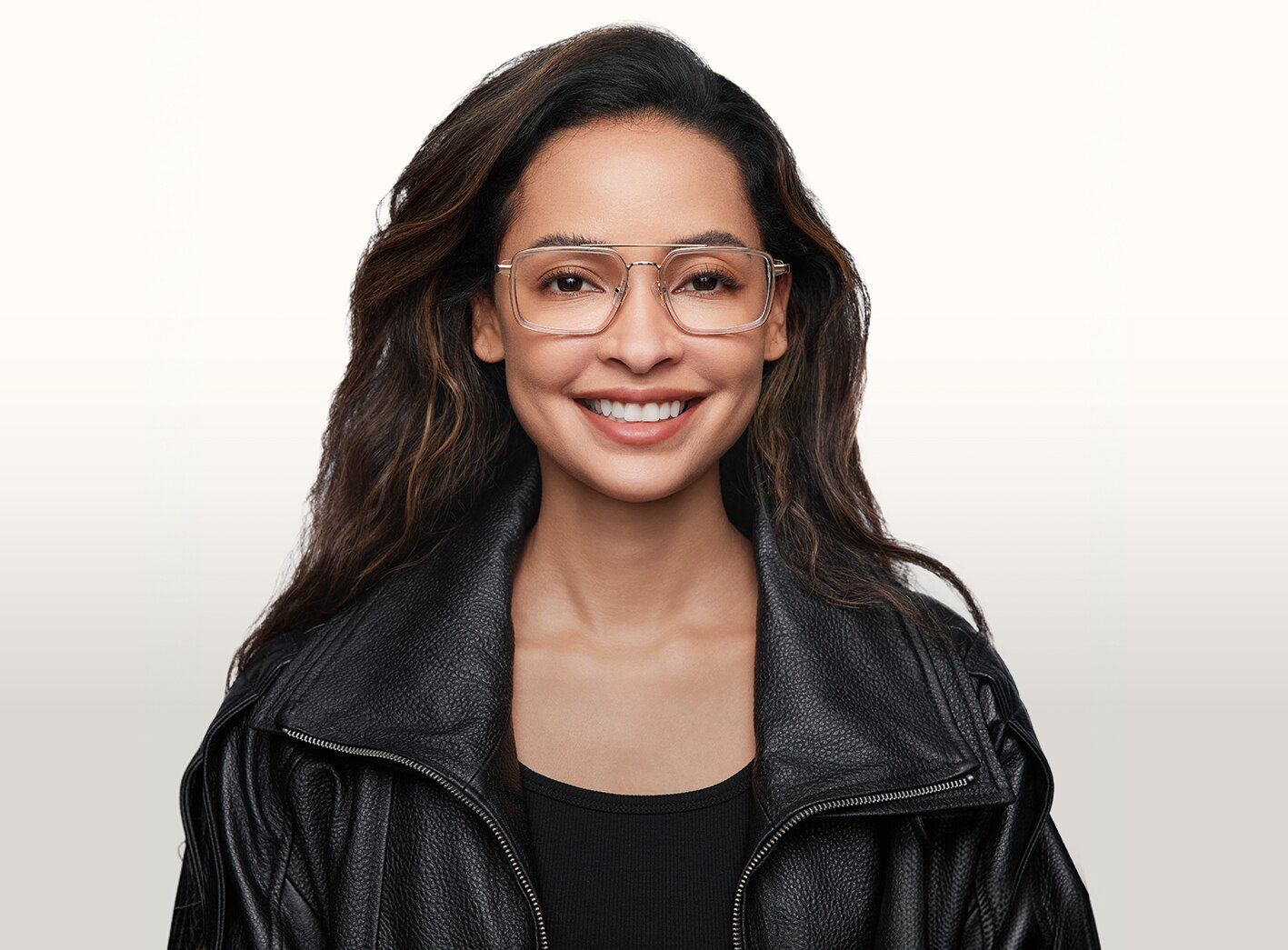 Lady wearing pink tortoise eyeglasses